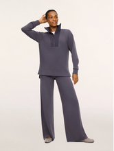Load image into Gallery viewer, Model wearing Spanx Wide Leg Pants paired with a matching half-zip pullover