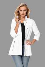Load image into Gallery viewer, Woman wearing a tailored utility jacket with gold buttons, zip pockets, and cinched waist