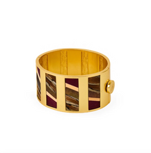Load image into Gallery viewer, Brackish Cora Striped Hinge Cuff featuring gold metal framework with feather inlay panels and button closure