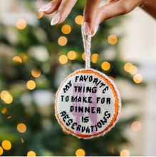Load image into Gallery viewer, Needlepoint Christmas ornament reading 'My Favorite Thing To Make For Dinner Is Reservations'