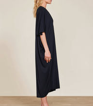 Load image into Gallery viewer, Woman wearing a flowy, oversized long caftan dress with short kimono-style sleeves