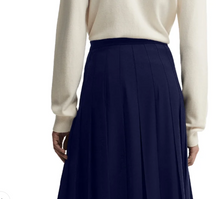 Load image into Gallery viewer, Barbour Delilah pleated midi skirt with elasticated waistband, styled with cream sweater