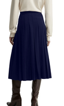 Load image into Gallery viewer, Barbour Delilah pleated midi skirt styled with cream sweater and tall leather boots