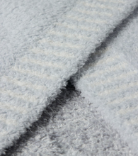 Load image into Gallery viewer, Close-up of ultra-soft, plush Barefoot Dreams blanket showing luxurious fluffy texture and folded edge
