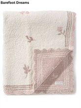 Load image into Gallery viewer, Folded cream and blush pink floral scallop-edge baby blanket by Barefoot Dreams