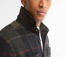 Load image into Gallery viewer, Man wearing Barbour Woodland Check Overshirt with classic tartan pattern and button collar