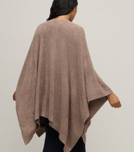 Load image into Gallery viewer, Woman wearing a cozy oversized knit wrap poncho with draped asymmetrical hem, back view