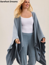Load image into Gallery viewer, Woman wearing a cozy oversized draped wrap cardigan paired with ribbed lounge pants