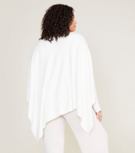 Load image into Gallery viewer, Woman wearing a cozy, draped wrap shawl with an asymmetrical hemline, shown from behind