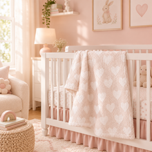 Load image into Gallery viewer, Soft plush heart-patterned baby blanket draped over a white nursery crib