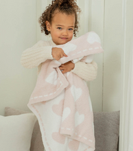 Load image into Gallery viewer, Toddler girl hugging a soft plush Barefoot Dreams heart-patterned receiving blanket