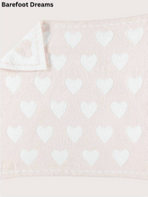 Load image into Gallery viewer, Soft plush receiving blanket featuring an all-over heart pattern with folded corner detail