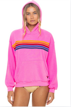 Load image into Gallery viewer, Oversized pullover hoodie with rainbow chest stripes, kangaroo pocket, and ribbed cuffs