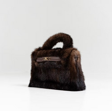 Load image into Gallery viewer, Luxurious mink fur handbag with structured top handle and gold-tone clasp closure