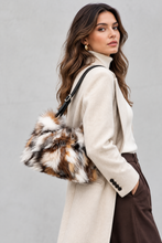 Load image into Gallery viewer, Multicolor fox fur shoulder bag with black leather strap, worn by model