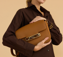 Load image into Gallery viewer, Tan leather structured flap crossbody handbag with gold hardware and feather detail panel