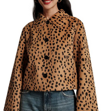 Load image into Gallery viewer, Woman wearing a cropped cheetah print button-front jacket with wide sleeves, paired with jeans
