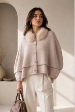 Load image into Gallery viewer, Woman wearing a layered wool poncho with faux fur collar and button front closure