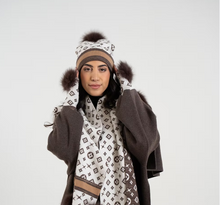 Load image into Gallery viewer, Brown and white monogram knit hat with fox fur pom-pom worn by model