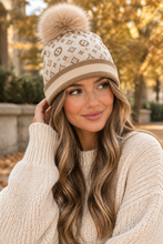 Load image into Gallery viewer, Cream knit beanie with LV-style monogram pattern and tan fox fur pom-pom