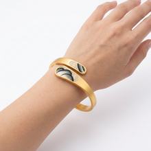Load image into Gallery viewer, Brackish Lainey Bezel Hinge Cuff featuring feather inlay details worn on a wrist