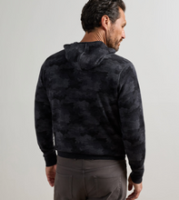 Load image into Gallery viewer, Man wearing a reversible camouflage popover hoodie, shown from the back