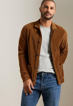 Load image into Gallery viewer, Man wearing a corduroy button-front chore coat layered over a casual t-shirt and jeans