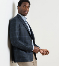 Load image into Gallery viewer, Man wearing a windowpane plaid sport jacket over a light dress shirt and chinos