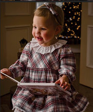 Load image into Gallery viewer, Toddler girl wearing a festive plaid dress with lace collar and matching bow headband