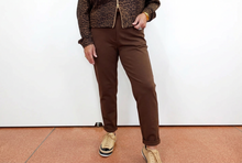 Load image into Gallery viewer, Straight-leg chino pants with cuffed hems, styled with a leopard print jacket and sneakers