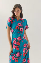 Load image into Gallery viewer, Woman wearing a short sleeve midi dress with vibrant floral print and fitted silhouette