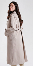 Load image into Gallery viewer, Woman wearing a classic belted trench coat with button cuffs and side pockets