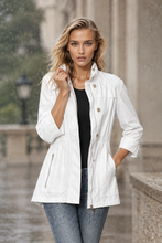 Load image into Gallery viewer, Woman wearing a lightweight utility jacket with button detail and cinched waist outdoors