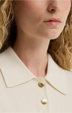 Load image into Gallery viewer, Woman wearing Barbour Wynn Polo Sweater with gold logo buttons and classic collar