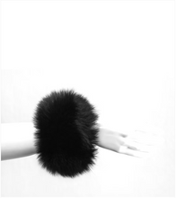 Load image into Gallery viewer, Luxurious fluffy fox fur cuff bracelet worn on a slender wrist, minimalist style