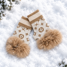 Load image into Gallery viewer, Luxurious knit fingerless gloves featuring monogram print and fluffy fox fur pom-pom trim, displayed on snow