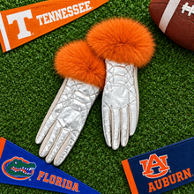 Load image into Gallery viewer, Metallic quilted puffer gloves with fluffy fox fur trim, styled with college football pennants