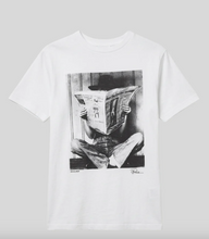 Load image into Gallery viewer, Graphic tee featuring a vintage black-and-white photo of a person reading a newspaper