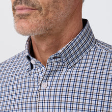 Load image into Gallery viewer, Man wearing a classic plaid button-down collared dress shirt with a trim fit