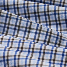 Load image into Gallery viewer, Close-up of a plaid performance dress shirt fabric showing woven checkered pattern texture