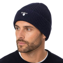 Load image into Gallery viewer, Man wearing a ribbed knit navy Barbour beanie hat with embroidered logo