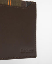 Load image into Gallery viewer, Close-up detail of a brown leather Barbour wallet showing embossed logo and tartan lining