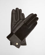 Pair of leather and ribbed knit gloves with gold button detail, laid flat
