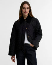 Load image into Gallery viewer, Woman wearing a quilted diamond-pattern jacket with corduroy collar and tortoiseshell buttons