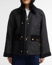Load image into Gallery viewer, Model wearing Barbour quilted jacket with gold hardware, corduroy collar and patch pockets