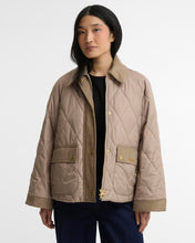 Load image into Gallery viewer, Woman wearing a diamond-quilted jacket with corduroy collar, snap buttons, and patch pockets