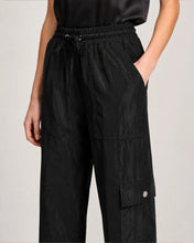Load image into Gallery viewer, Black wide-leg cargo pants with elastic drawstring waist and snap button pocket detail