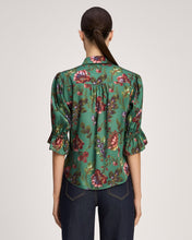 Load image into Gallery viewer, Back view of floral blouse with ruffled cuffs, three-quarter sleeves, and gathered yoke detail