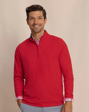 Load image into Gallery viewer, Man wearing a classic quarter-zip pullover sweater layered over a plaid button-down shirt