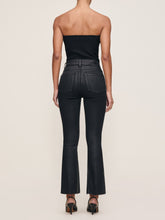 Load image into Gallery viewer, Back view of model wearing high-rise cropped boot-cut coated jeans with black strapless top